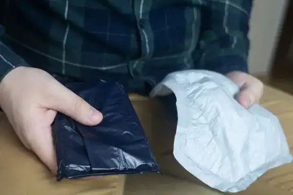 image of man holding stool incontinence Bradford  products