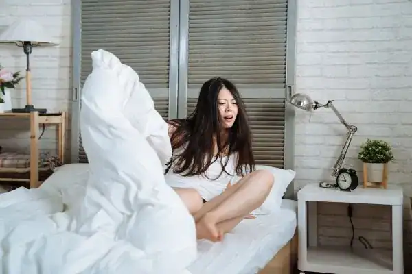 Image of woman getting up because of nighttime leaks Bradford